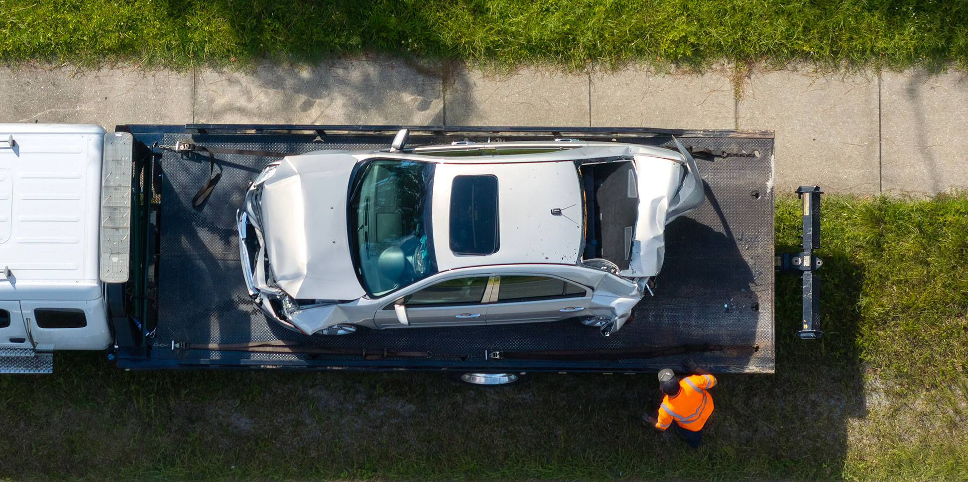 overhead view of wrecked car on flatbed